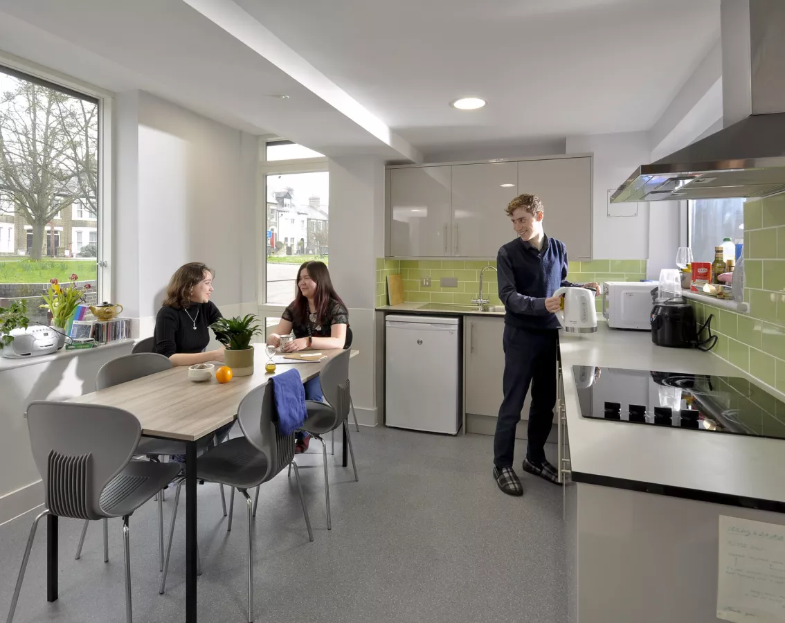 Students in E staircase kitchen