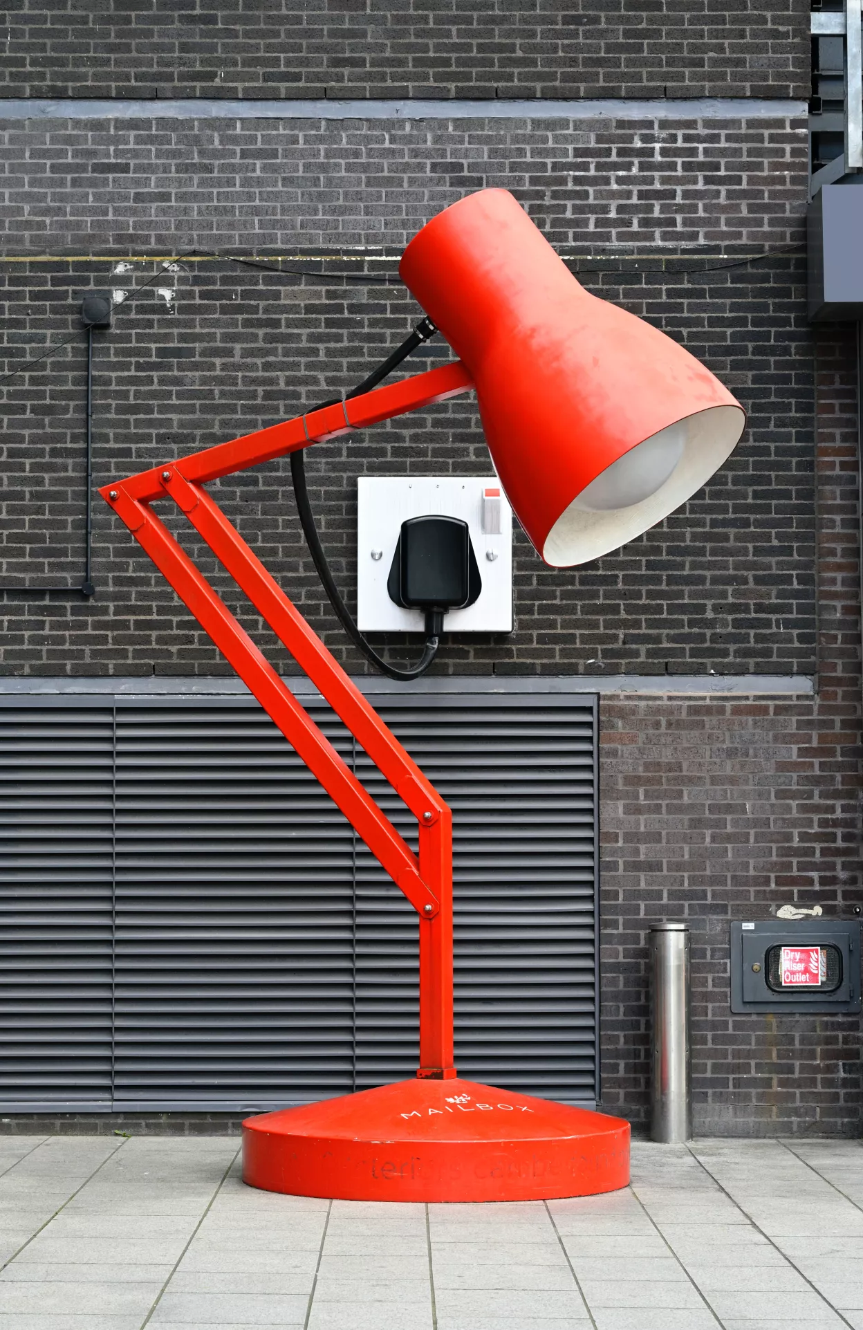 Red anglepoise lamp