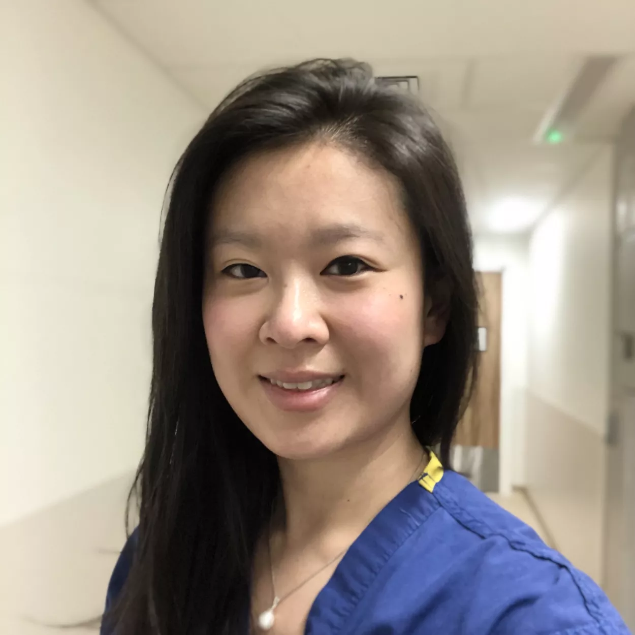 Headshot of Dr Maggie Huang in a hospital ward