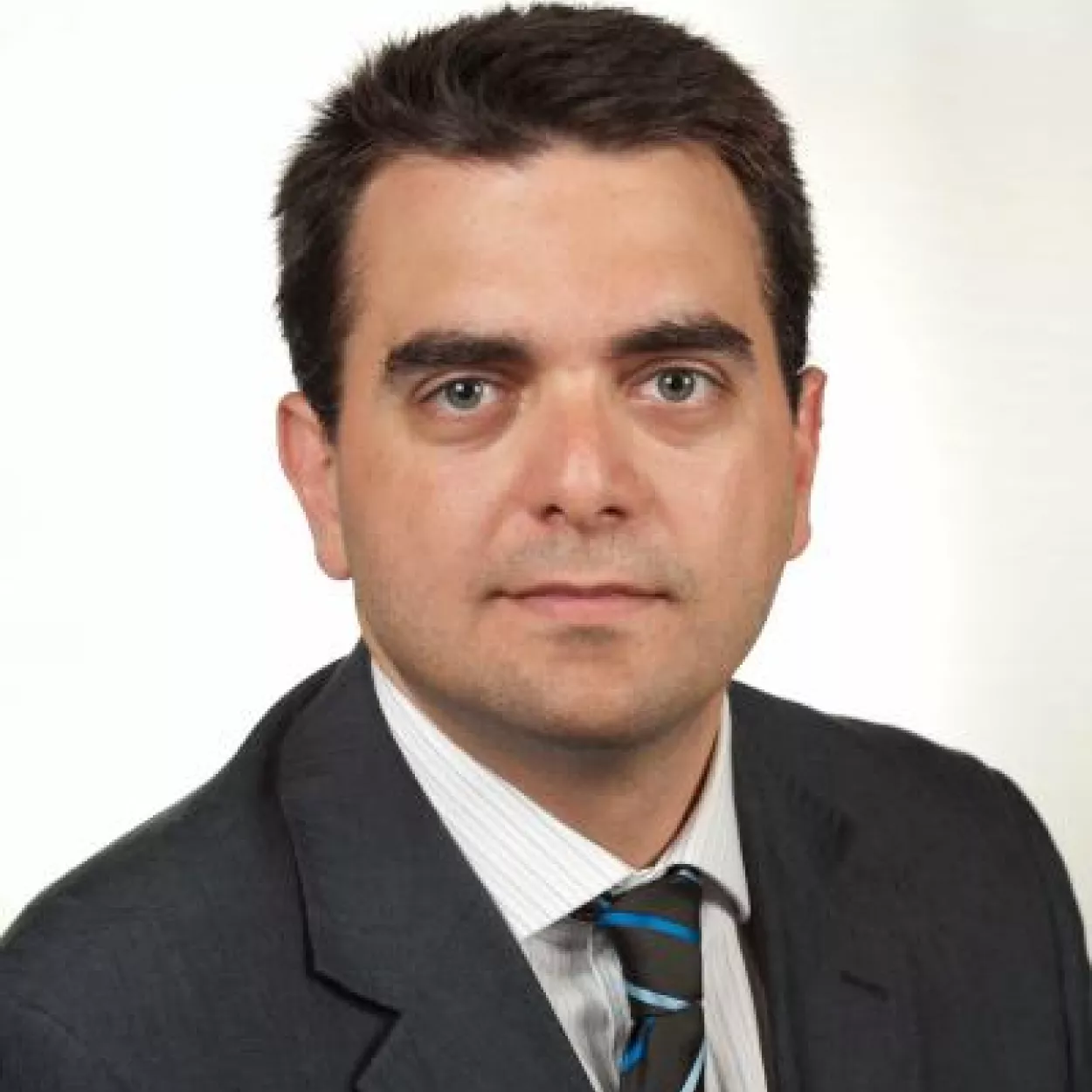 Headshot of Dr Christos	Genakos