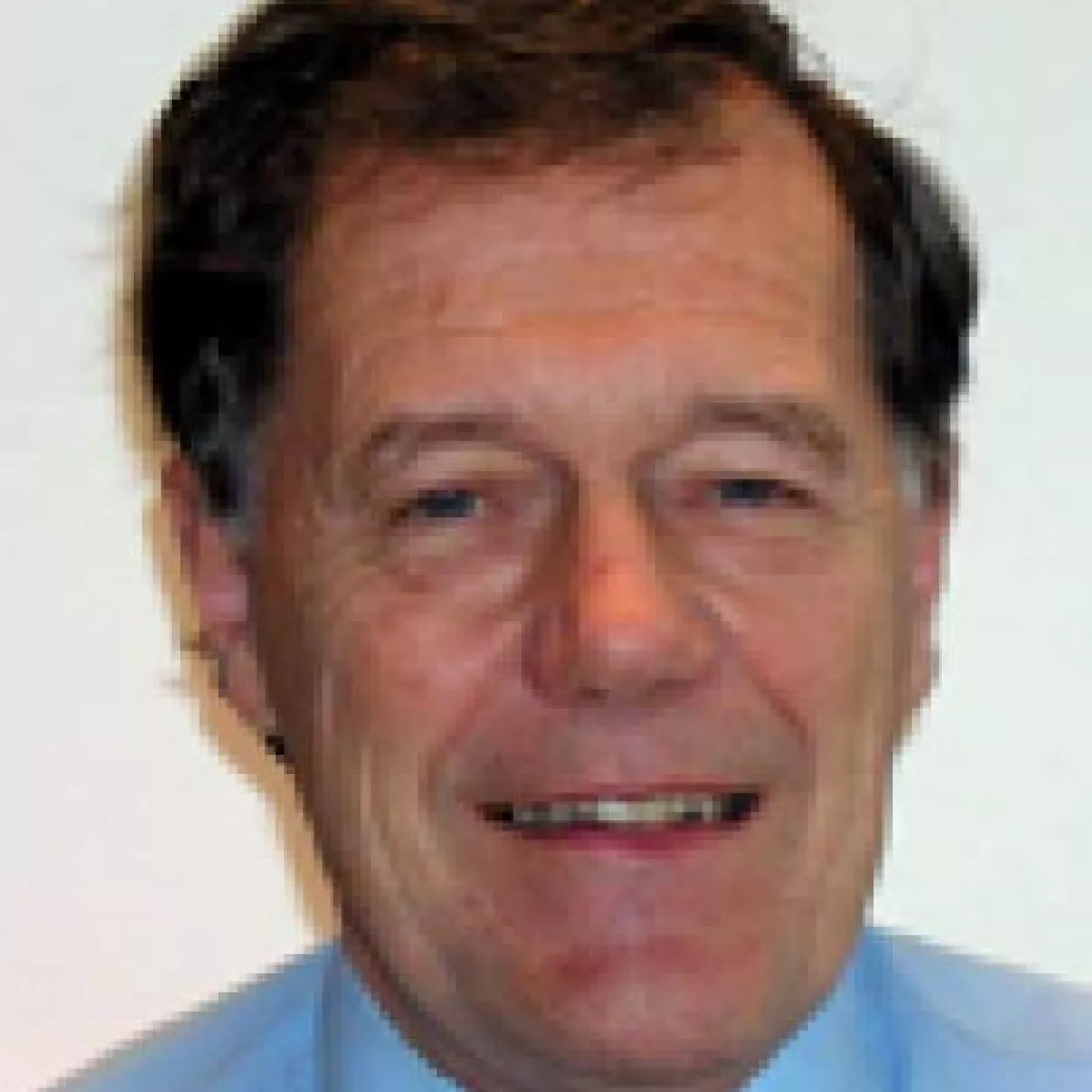 Headshot of professor Geoffrey	Whittington