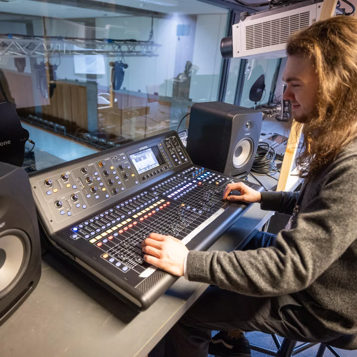 Alex at the mixing desk in the Auditorium control room